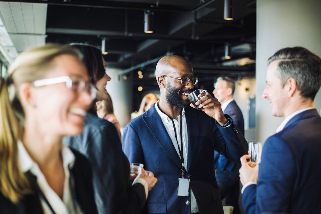 Conferences and Events: People mingle at a work event