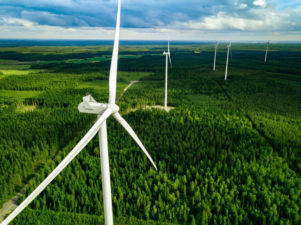 Sustainability & Transition: Windmills extend outward to the horizon